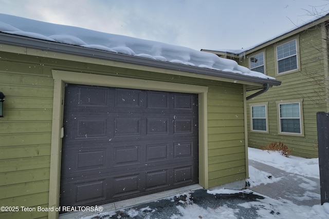 view of snow covered garage