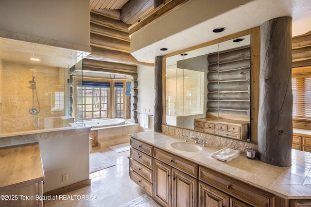 bathroom with vanity, rustic walls, tile patterned floors, and plus walk in shower