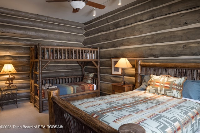 carpeted bedroom featuring log walls