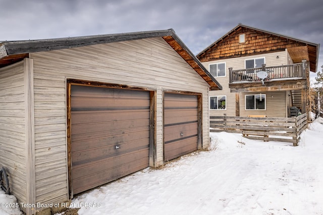 view of snow covered garage