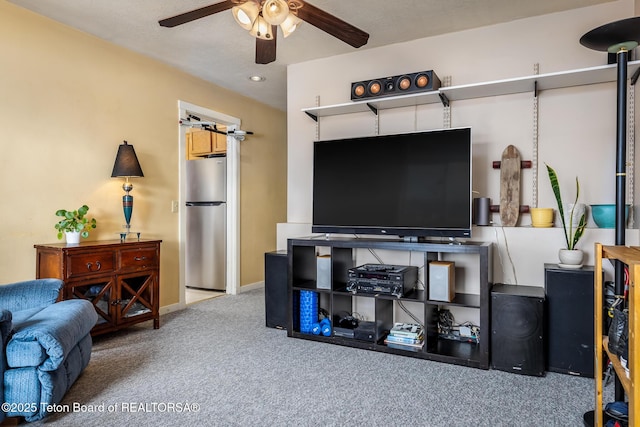 living room with ceiling fan and carpet