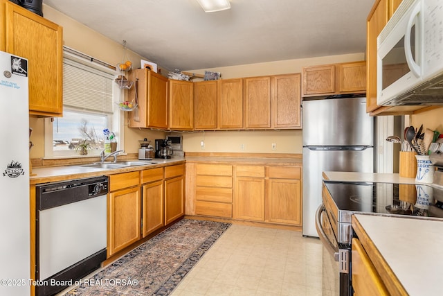 kitchen featuring stainless steel appliances and sink