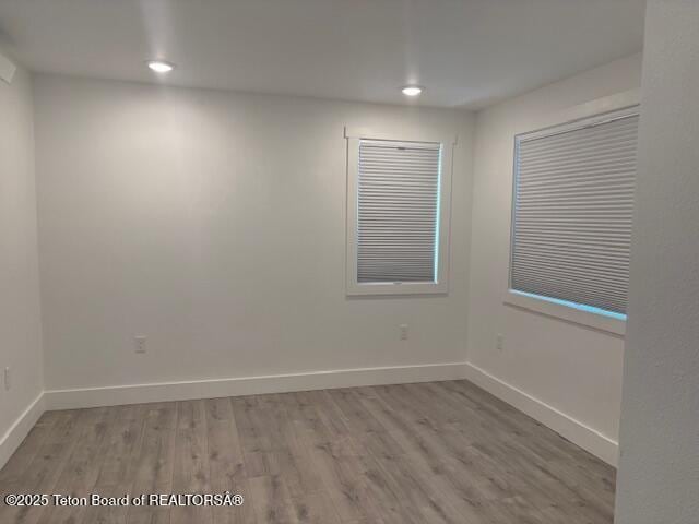 spare room featuring light hardwood / wood-style floors