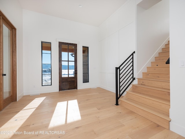 entryway featuring light hardwood / wood-style floors and french doors