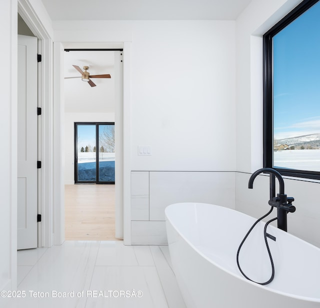 bathroom featuring tile patterned floors and a bathing tub