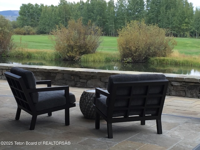 view of patio / terrace featuring a water view