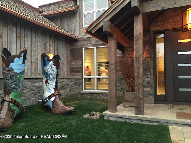 doorway to property with a patio area