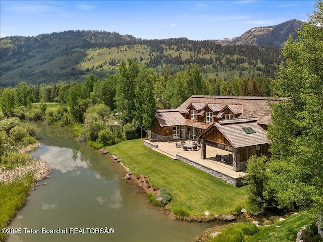 4370 W Greens Pl, Wilson, WY 83014 - view of subject property with a forest and a water and mountain view