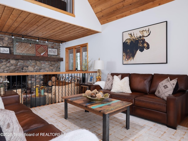 living room with wood ceiling and rail lighting