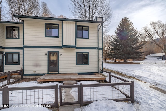 view of snow covered house