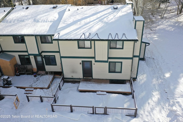 view of snow covered house