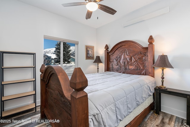 bedroom featuring ceiling fan and dark hardwood / wood-style flooring