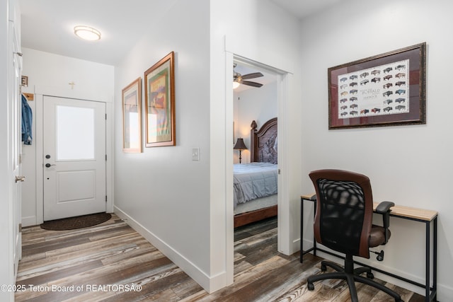 hall with hardwood / wood-style floors