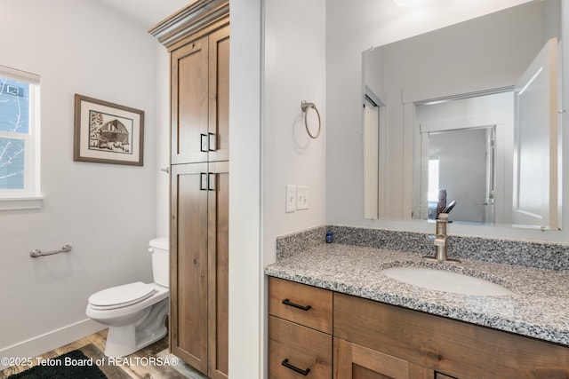 bathroom with vanity, a shower with shower door, wood-type flooring, and toilet