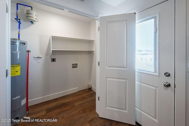 washroom with hookup for an electric dryer, dark hardwood / wood-style flooring, hookup for a washing machine, and water heater