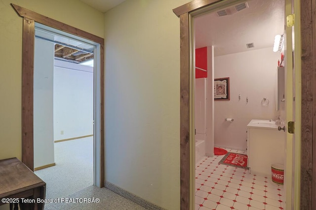 bathroom featuring shower / bath combination and vanity