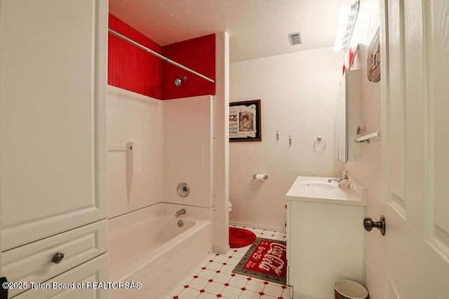 bathroom featuring vanity and tub / shower combination