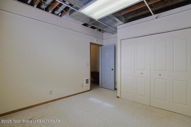 unfurnished bedroom with a closet