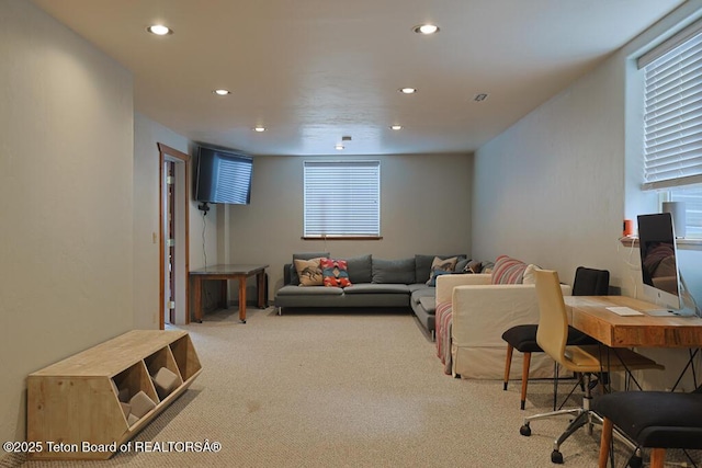 carpeted living room featuring a wealth of natural light