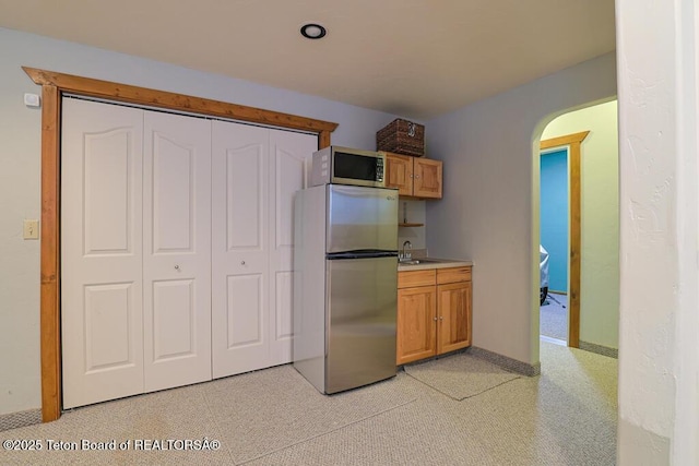 kitchen featuring stainless steel appliances and sink