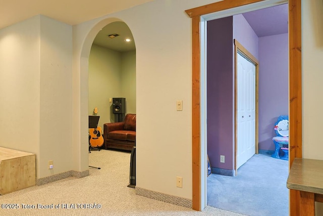 hallway with light carpet