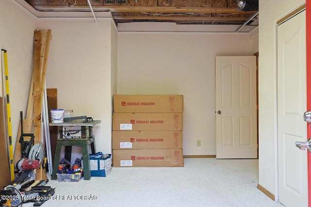 basement with carpet flooring