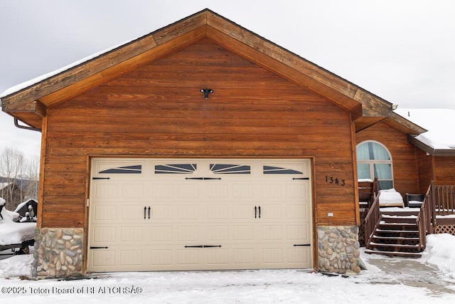 view of snow covered garage