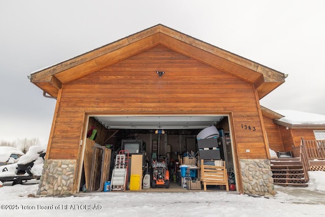 view of snow covered garage