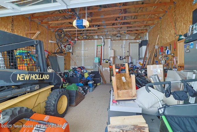 garage with a garage door opener and a workshop area