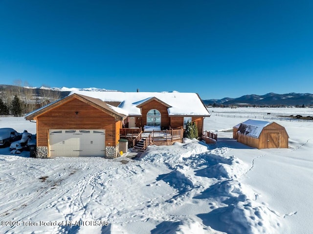 view of front of house with a garage and a mountain view