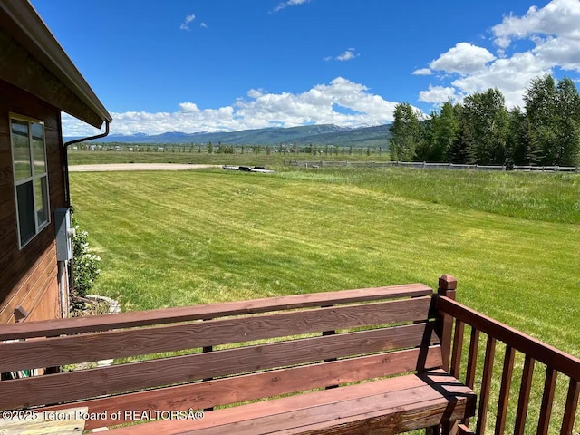 view of yard featuring a rural view and a mountain view