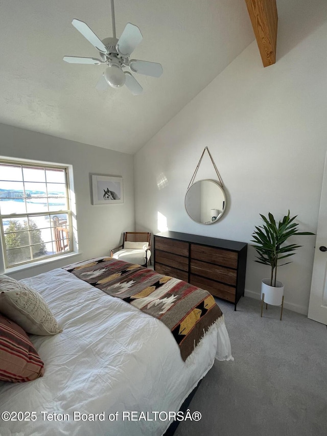 carpeted bedroom featuring lofted ceiling and ceiling fan