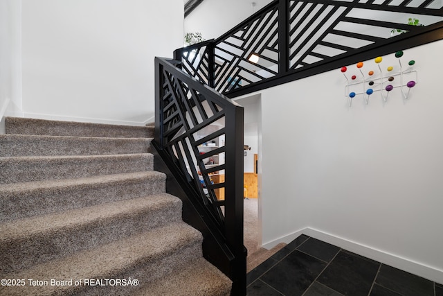 staircase with tile patterned flooring