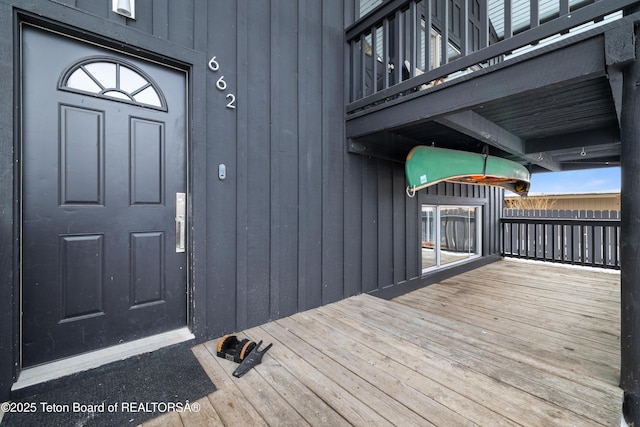 doorway to property featuring a wooden deck