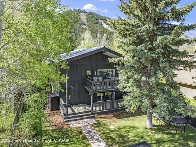 662 E Hansen Ave, Jackson, WY 83001 - back of property featuring a yard and a deck with mountain view