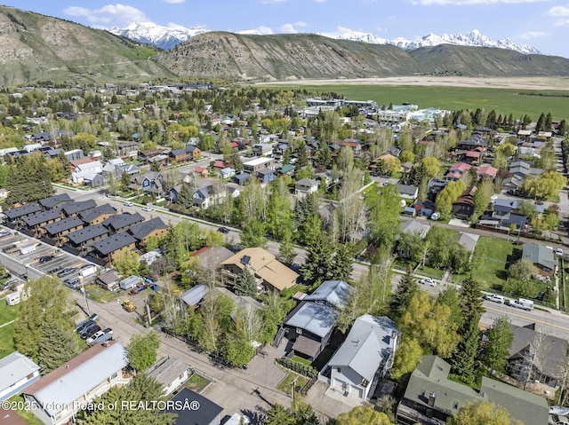 662 E Hansen Ave, Jackson, WY 83001 - aerial view of property and surrounding area featuring mountains and nearby suburban area