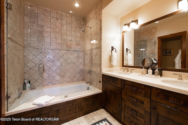 bathroom with tiled shower / bath combo, vanity, and tile patterned floors