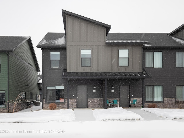 view of snow covered house