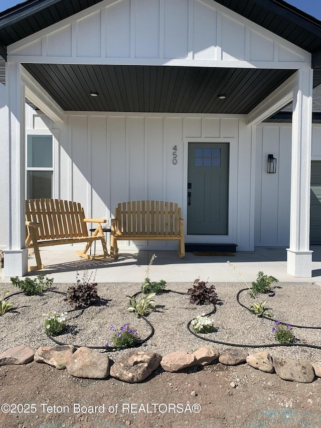 doorway to property with a porch