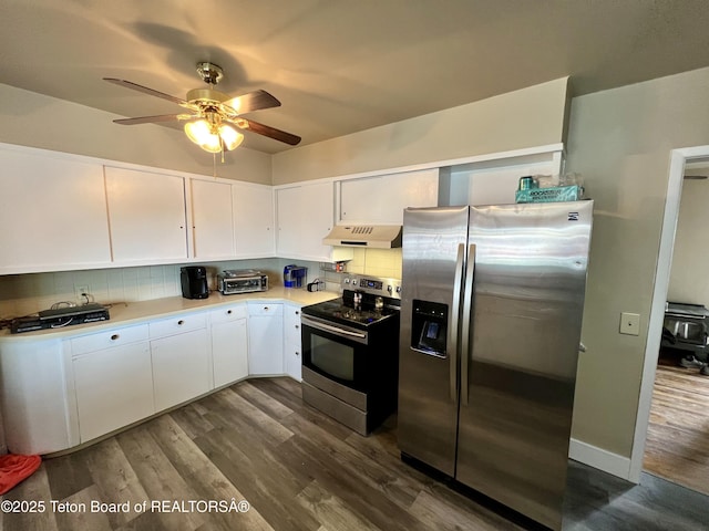 kitchen featuring appliances with stainless steel finishes, dark hardwood / wood-style floors, and white cabinets