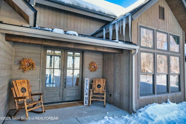 property entrance featuring french doors