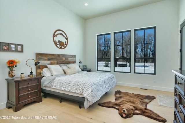 bedroom with light hardwood / wood-style floors