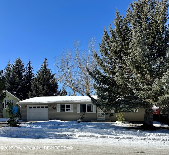 view of front of property with a garage