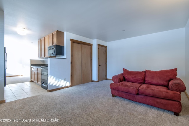 living room featuring light carpet