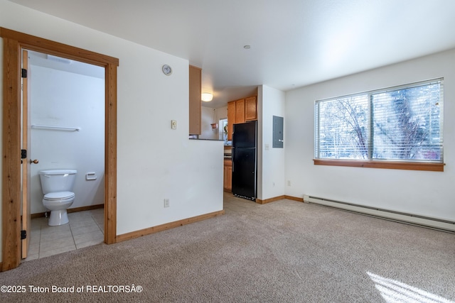 unfurnished living room with light carpet, electric panel, and baseboard heating