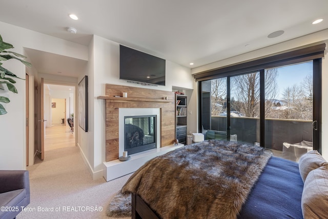 bedroom featuring access to outside and light carpet