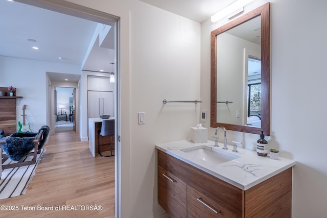 bathroom with vanity and hardwood / wood-style flooring