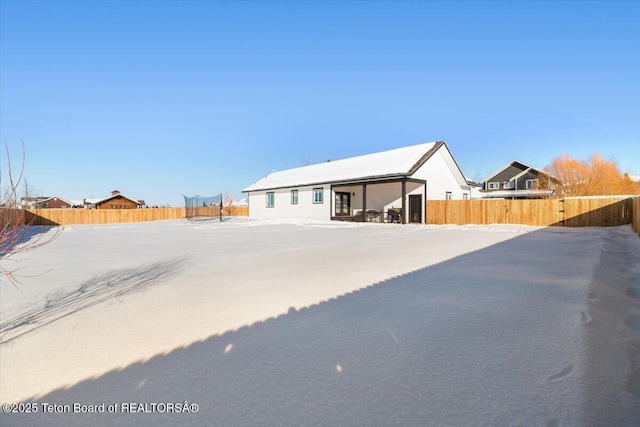 view of snow covered property