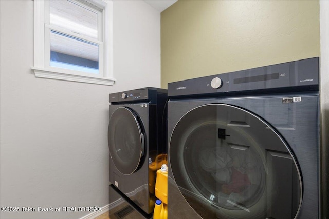 laundry room featuring independent washer and dryer