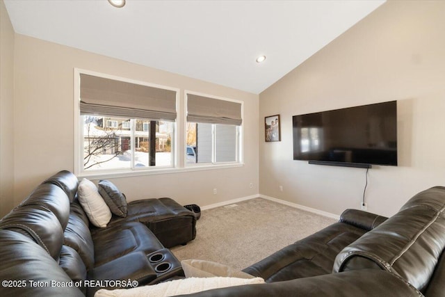 carpeted living room featuring vaulted ceiling